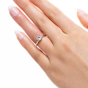  Lab-grown diamond rose gold four prong solitaire engagement ring.