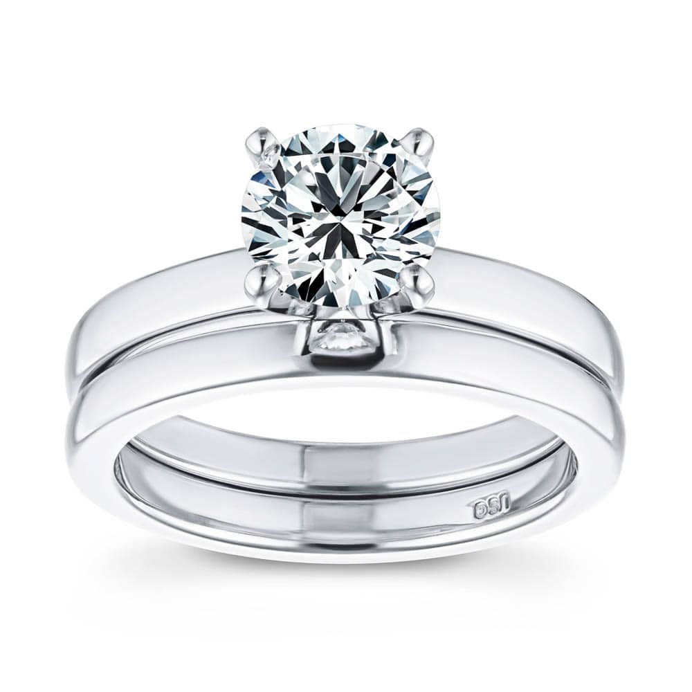 Shown with a 1.0ct Round cut Lab-Grown Diamond in recycled 14K white gold with a comfort fit wedding band 
