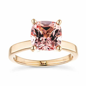  solitaire engagement ring Shown with a 1.0ct cushion cut pink sapphire lab created gemstonein recycled 14K yellow gold