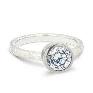 bezel set solitaire engagement ring with satin hammer finish in 14k white gold metal