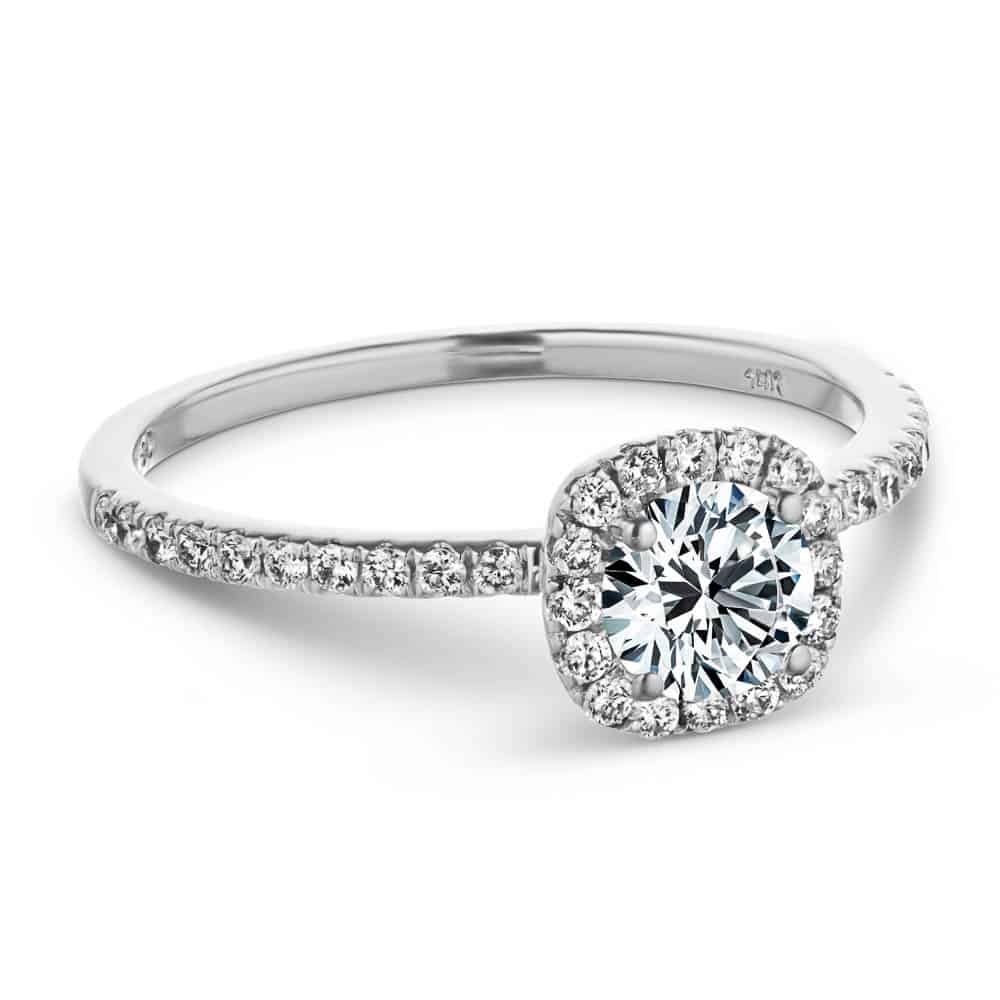 Shown with a 1.0ct Round cut Lab-Grown Diamond with a diamond accented halo and accented band in recycled 14K white gold 