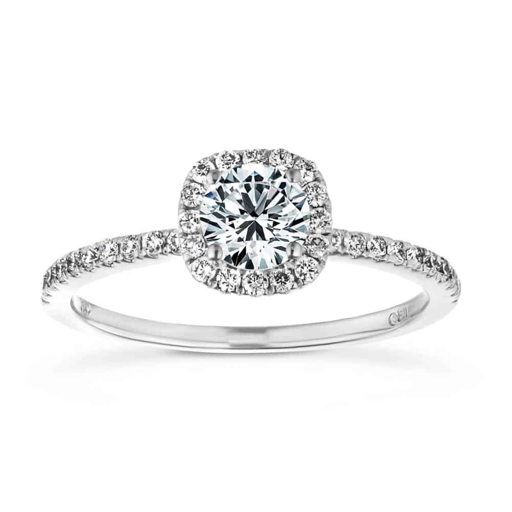 Shown with a 1.0ct Round cut Lab-Grown Diamond with a diamond accented halo and accented band in recycled 14K white gold 