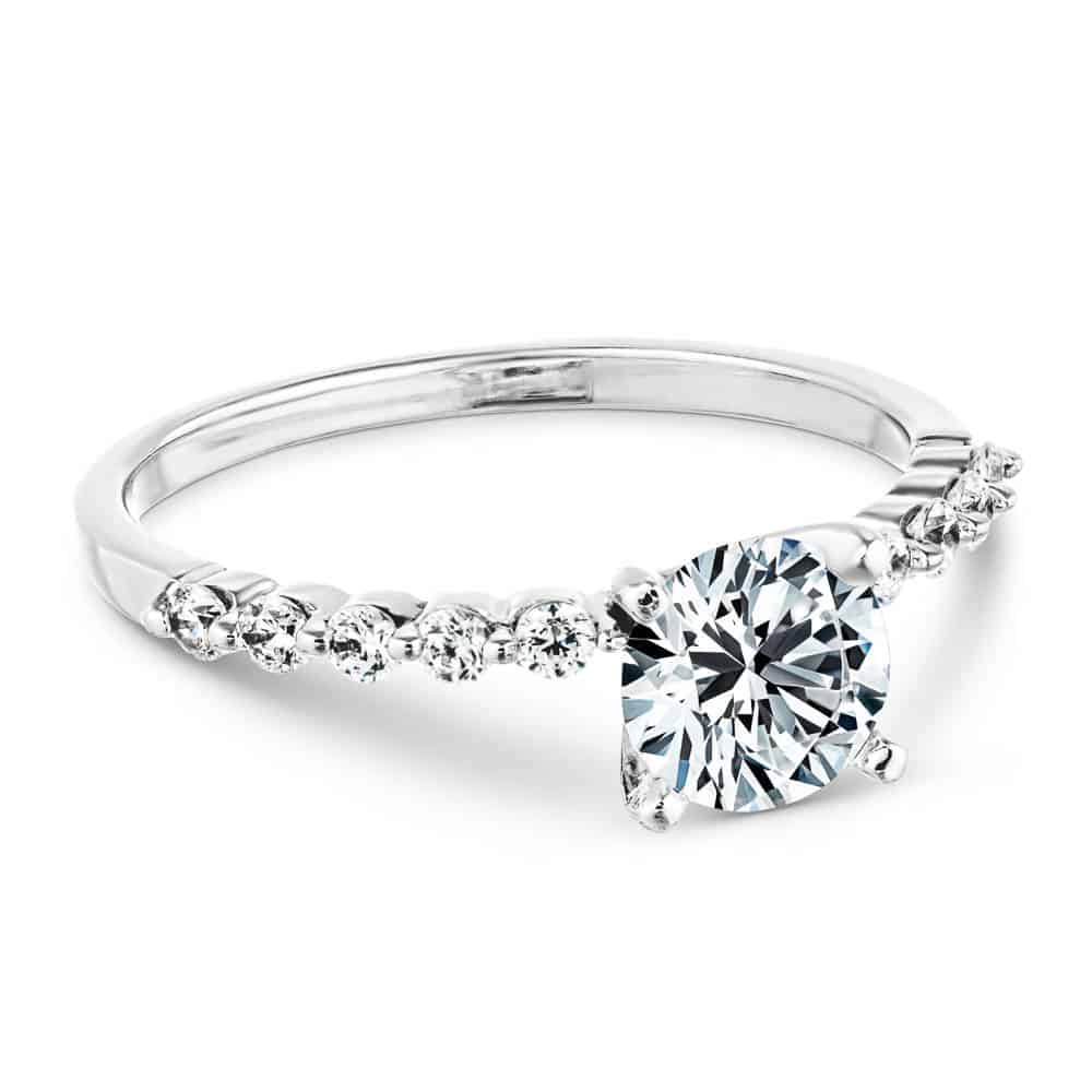 Shown with a 1.0ct Round cut Lab-Grown Diamond with accenting diamonds on the band in recycled 14K white gold 