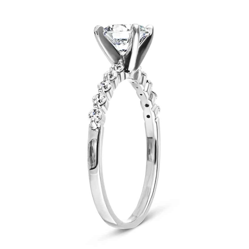 Shown with a 1.0ct Round cut Lab-Grown Diamond with accenting diamonds on the band in recycled 14K white gold 