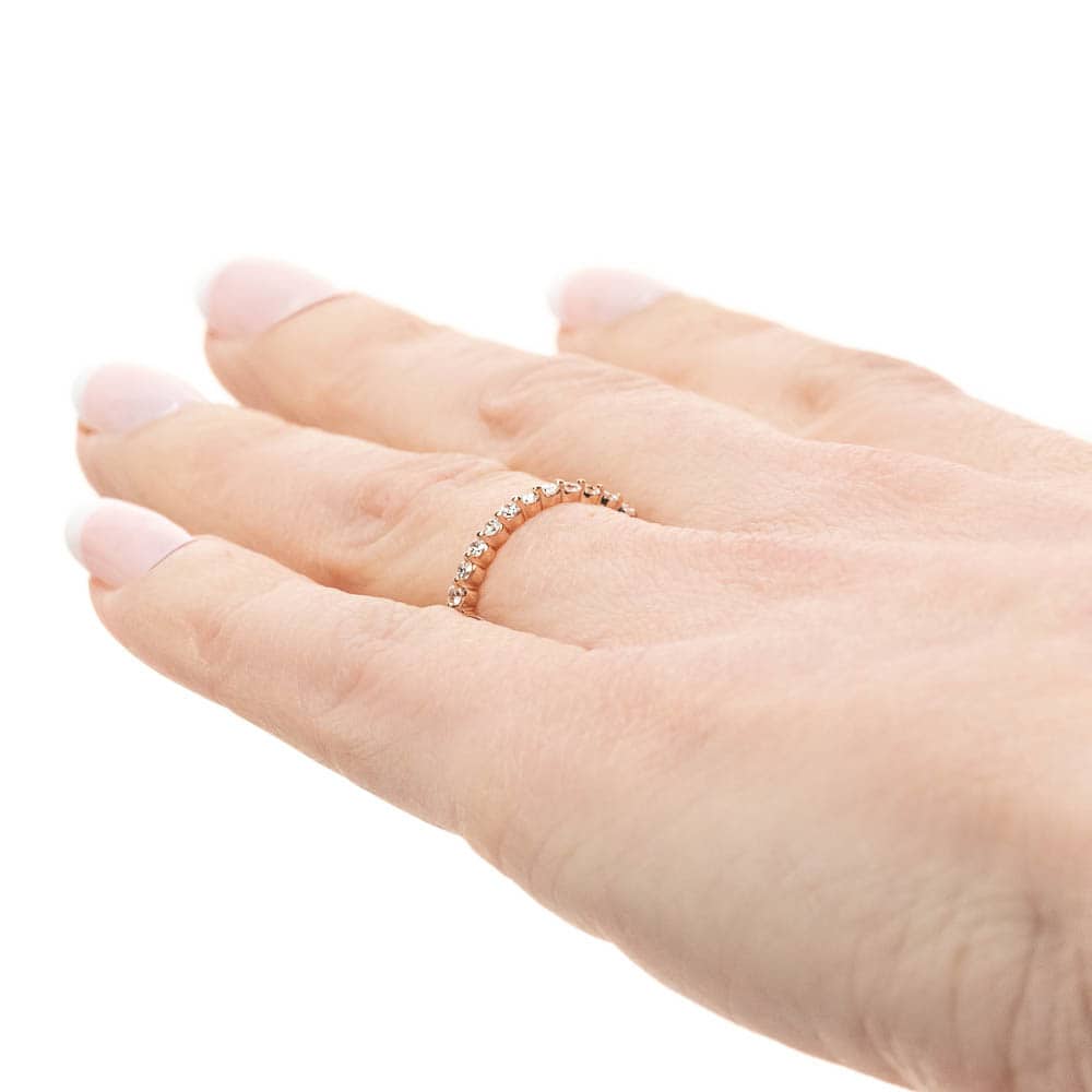 Diamond accented wedding band in recycled 14K rose gold 