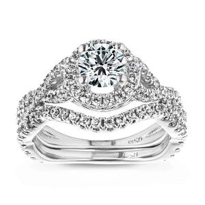  wedding set Shown with a 1.0ct Round cut Lab-Grown Diamond with a diamond accented halo and twisted band in recycled 14K white gold with matching wedding band
